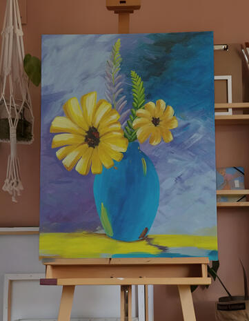 blue vase with yellow flower.